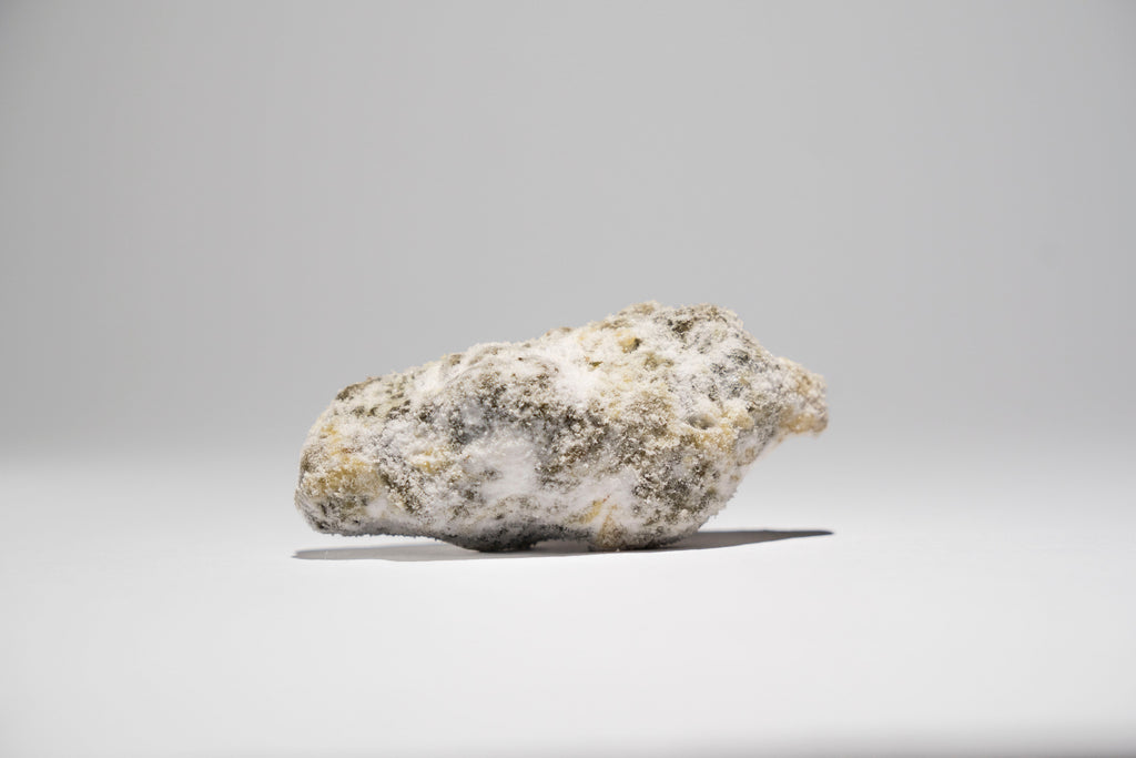 Ice Rock on a gray background 