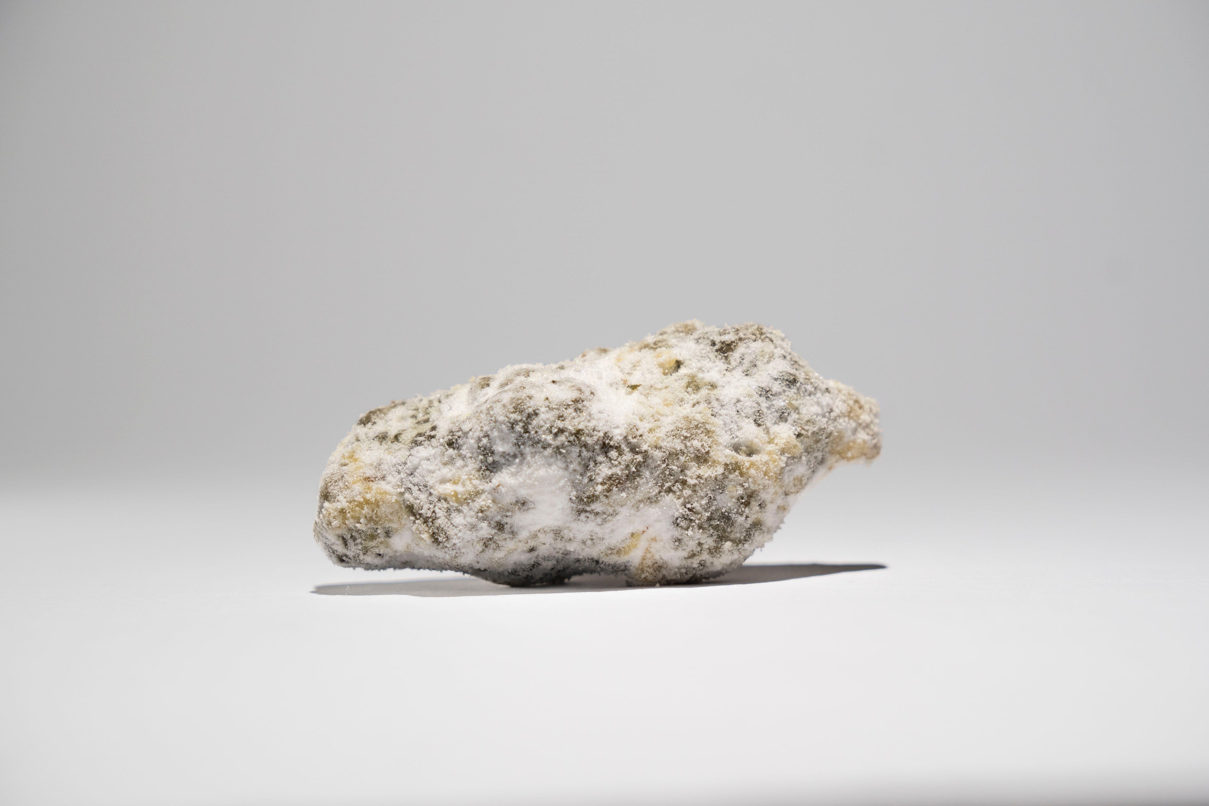 Ice Rock on a gray background 