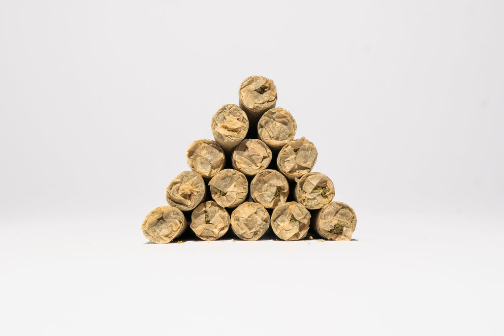 Pyramid of THCa pre rolls on a white background