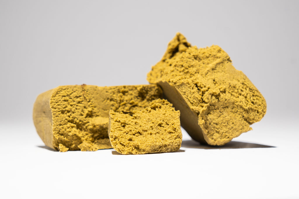 Two pieces of yellowish brown material on a white background
