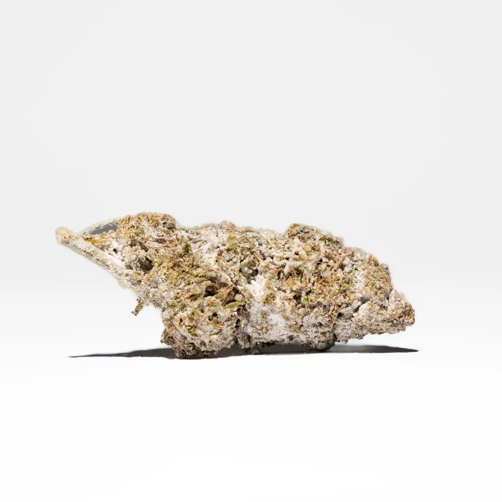 Crystal Kush 25% THCA flower shown as a frosty bud with visible orange trichomes and a dense, resin-coated structure on a clean light background.
